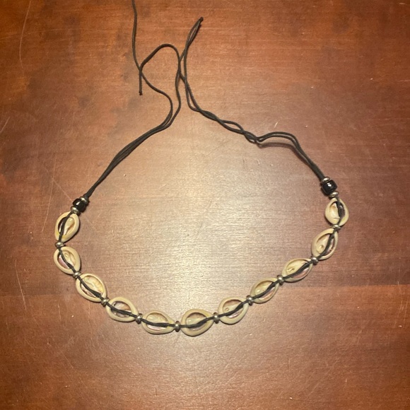 Hand Crafted Jewelry - Vintage cowrie shell necklace on black cord. About 25 inches Can use as choker